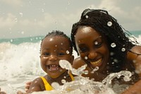 Mother and child playing in the water photography recreation shoreline.