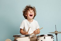 Boy playing drum happy recreation percussion.