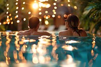 Young couple traveler relaxing and enjoying a tropical resort pool photo photography recreation.