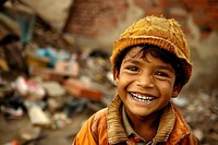 Poor child smiling happily in an atmosphere of poverty clothing apparel person.