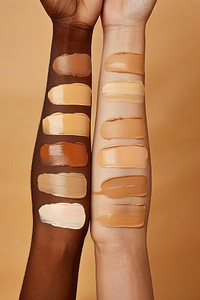 Liquid face foundation swatch in shades of skin tone colors arm person human.