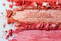 Shimmer blush on swatch in 3 shades of pink and coral orange colors cosmetics beef food.