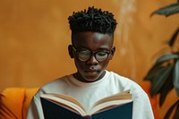 Black boy Students reading book publication.