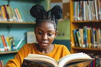 Black girl Students reading student book.