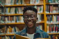 Happy Black boy Students portrait library reading.