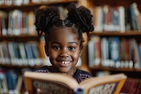 Happy Black little girl Students reading library student.