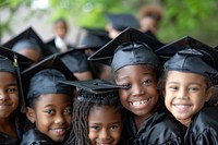 Black little students and graduates hug happy graduation clothing.