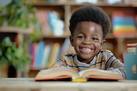 Happy little Black boy Students book publication person.