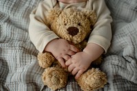 Baby hands baby teddy bear furniture.