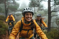 Smiling young woman in cycling gear riding bike transportation clothing.