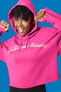 Happy woman in pink hoodie