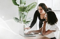 Businesswoman reading information on a laptop