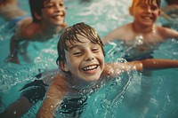 Children laughing and swimming in the pool happy accessories recreation.