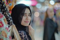 A happy Middle east young women friends with shopping bags photography face portrait.