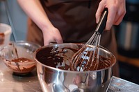 Chocolate in the pot cooking whisking cup.