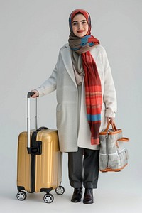 Middle east femaleTraveler with trolley clothing apparel baggage.