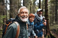 Smiling senior man hiking with friends photo photography backpacking.