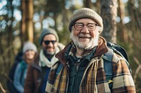 Smiling senior man hiking with friends photo photography accessories.
