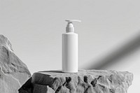 A white pump bottle mockup lotion shaker rock.