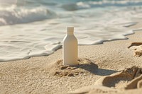 Bottle mockup beach sand shoreline.