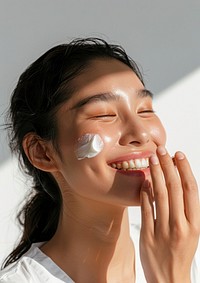 Woman applying cream on her face person female human.