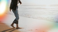 Girl walking barefoot at the shore
