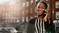 Black woman talking on the phone in a city