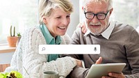Senior couple using a tablet remix