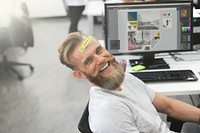 Be happy note on a bearded office workers forehead