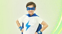 A young boy playing superhero