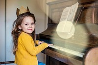 Adorable Cute Girl Playing Piano Concept