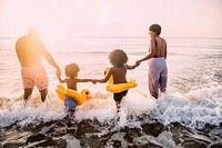 Black family having fun on the beach