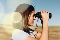 Woman using binocular in trip