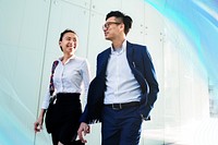Asian business people in a discussion while walking