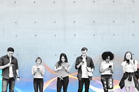 Group of young adults outdoors using smartphones together and chilling