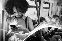 Young woman using a smartphone in a subway