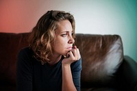 Stress woman sitting thoughtfully alone 