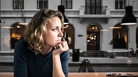 Stress woman sitting thoughtfully alone 