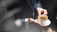 Businessman having coffee during break