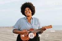 African American musician playing ukulele at the beach remix