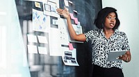 Businesswoman brainstorming using a blackboard remix