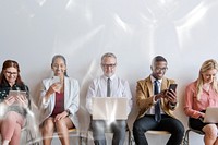 Diverse business people using digital devices