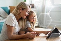 Mom and daughter watching a cartoon on a digital tablet