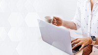 Businesswoman drinking coffee while working at home