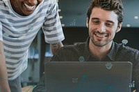 Colleagues discussing their work on a laptop