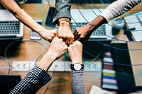 Diverse colleages giving a fist bump