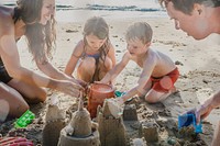 Family playing on the beach