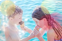 Children sharing ice cream by the pool