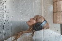 Woman listening to music on sofa remix