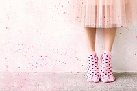 Woman in a skirt wearing pink socks wallpaper